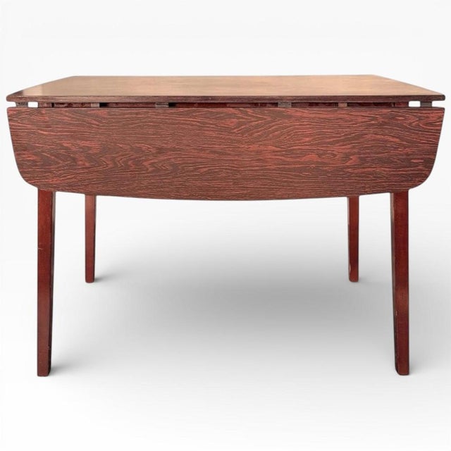 This vintage drop-leaf table from Schreiber Furniture England is a versatile kitchen table that combines classic mid-...