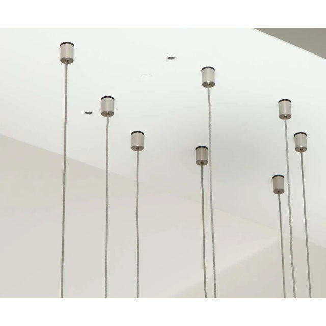 Wonderful Italian ball chandelier. The large rectangle metal plate supports sixteen suspended handblown glass ball globes...