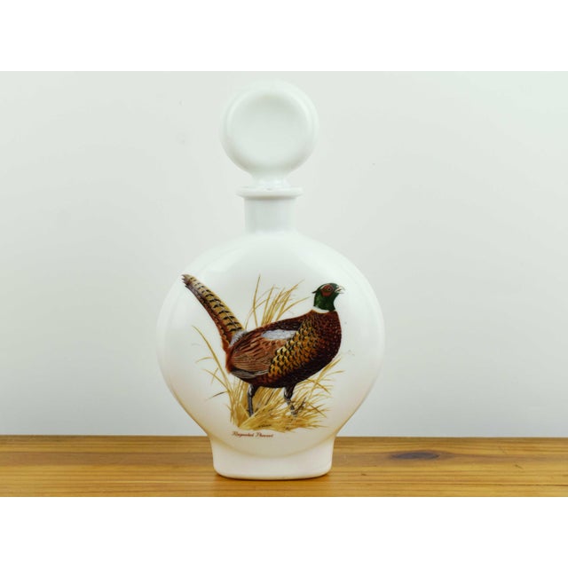 This charming mid-century decanter features a vibrant, detailed illustration of a Ring necked Pheasant by the renowned...