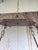 Monumental Spanish style wrought iron chandelier, circa 1950-1970. Hand-forged iron in a geometric octagonal form with 6...