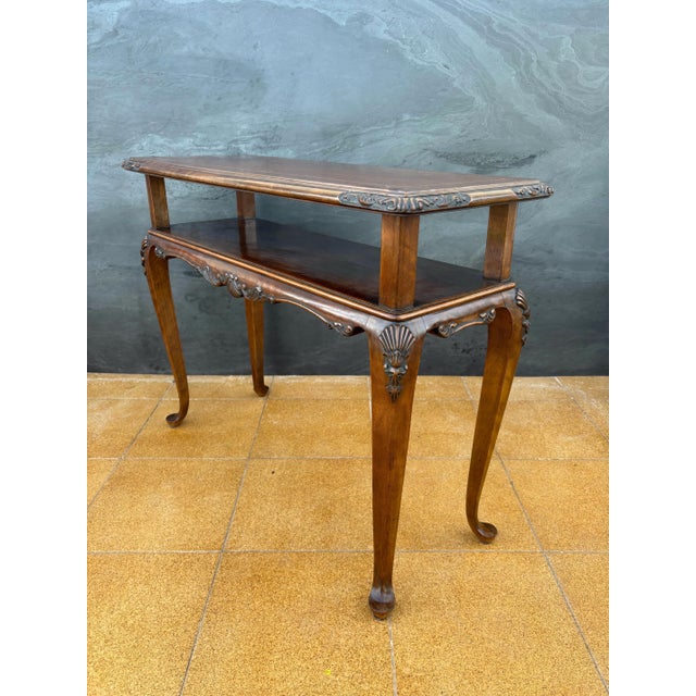 Elegant console table crafted in the Louis XV style, featuring graceful cabriolé legs and finely carved details. The apron...