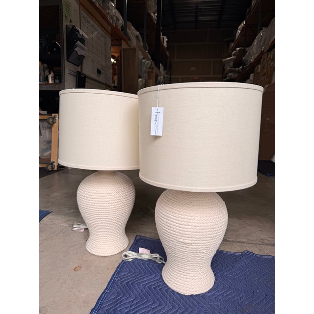 This coastal-contemporary table lamp brings relaxed sophistication to any space. Featuring a textured cream and soft...