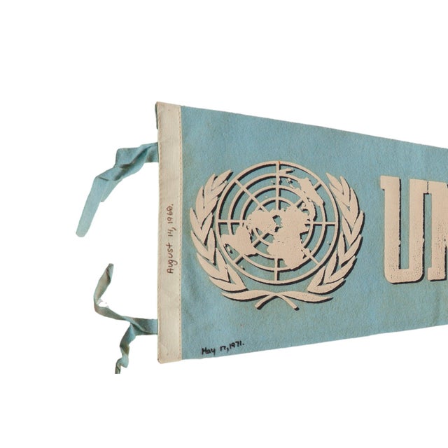 Vintage United Nations New York felt flag pennant circa 1960. Light blue and white mid-century souvenir from the United...