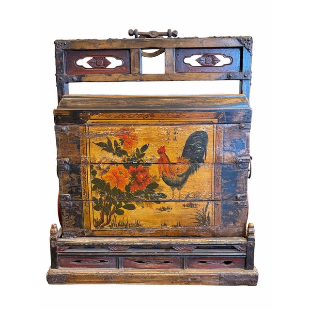 A remarkable antique Chinese stacking dowry chest featuring a distinctive multi-section design that combines...