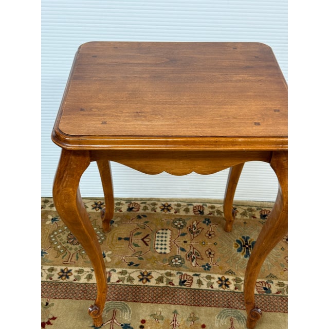 Design Plus Gallery presents a Pine Wood Side Table in the French Country Style. The table has exaggerated cabriolet legs...