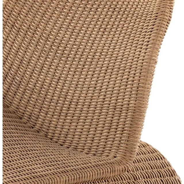 Based off a vintage shape, all-weather wicker seating brings dramatic curves to this statement-making rocking chair. Cover...