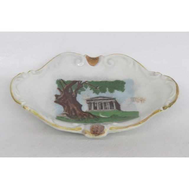This lovely Small Decorative Dish is made of Porcelain. This piece has a wonderful painted center motif depicting the...