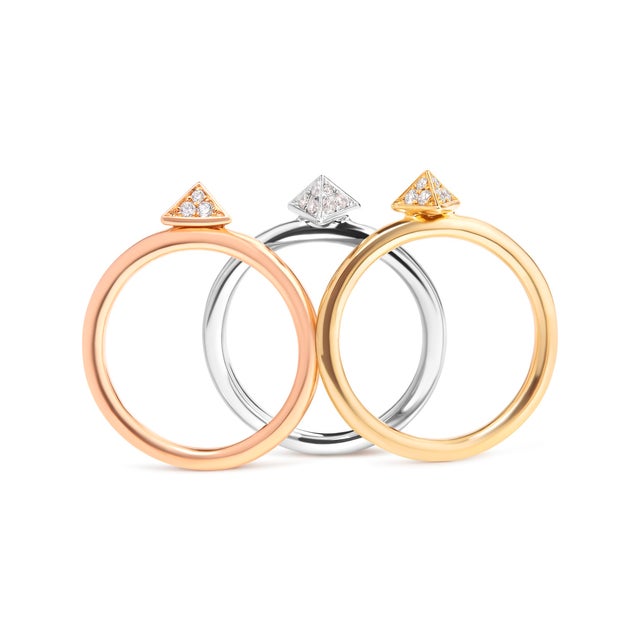 Discover the enchanting allure of elegance & versatility with this exquisite tri-color gold & diamond ring set....
