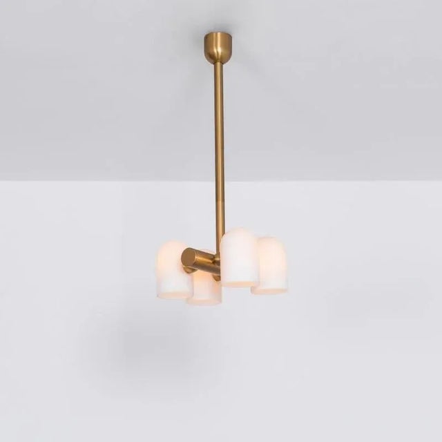 Brass 4 opal bulb chandelier by schwung dimensions: d 31.4 x w 27.3 x h 117.4 cm materials: solid brass, triplex opal...