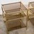 An elegant pair of vintage three-tier side tables dating from circa the 1970s, combining clean architectural lines with...