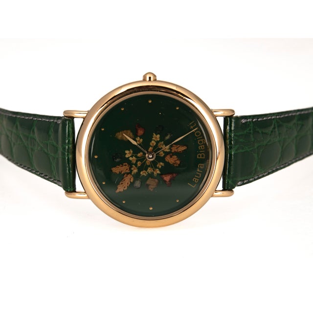 Vintage women's wristwatch by Laura Biagiotti (1990s), featuring Italian design and a Swiss quartz movement. The key...