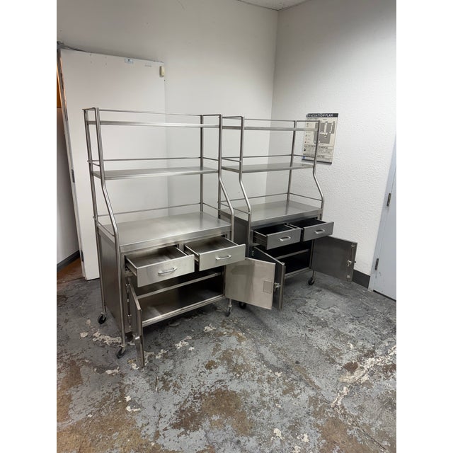 Design Plus Gallery presents a Pair of Stainless-Steel Rolling Cabinets by Shampaine Co. of St. Louis. Each cabinet is...