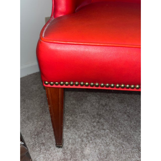 Description: An exceptionally striking mid-century modern style tub or barrel-back armchair upholstered in a vibrant...
