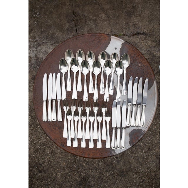 Spoons and forks, of which we have 12 of each, have an exceptional silver plating, 100, which means that 100 grams of...