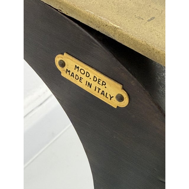 Oval coffee table with marble top, 1950s Frame with wooden and brass legs. Intact and in good condition with minor signs...