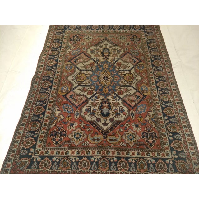 A beautiful Tabriz rug in Serapi design and color palette from the late 1800s. It is in a wonderful geometric design with...