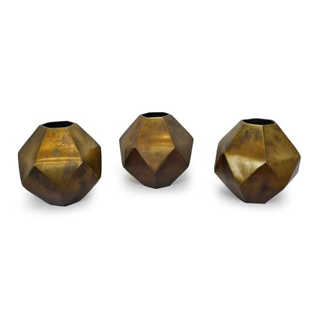 Beautiful modern brass finish cast aluminum prism vase. Striking geometric simple design makes a wonderful display piece...