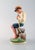 Royal Copenhagen porcelain figurine in high-quality overglaze. Young boy. Model number 905. Dated 1920s. Height: 18 cm. In...