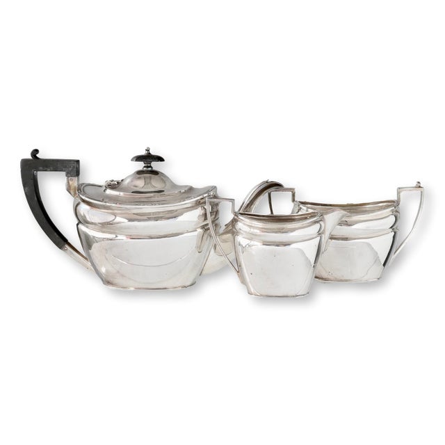 Don’t settle for boring mugs when you can sip from a work of Art Deco elegance. This three-piece silver-plated tea set by...