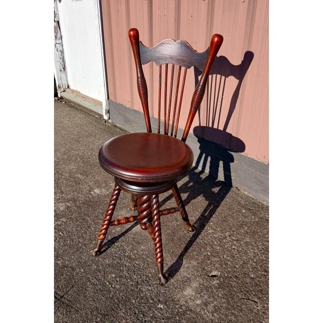 Antique Mahogany High Back Swivel Organ Stool with Claw Feet Chase Parker Meriden CT 1880 A Victorian antique mahogany...