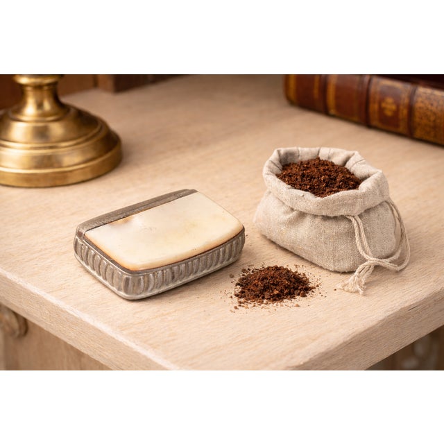 An elegant Antique Edwardian English snuff box crafted in pewter with a genuine mother of pearl lid, made by G. Smith &...