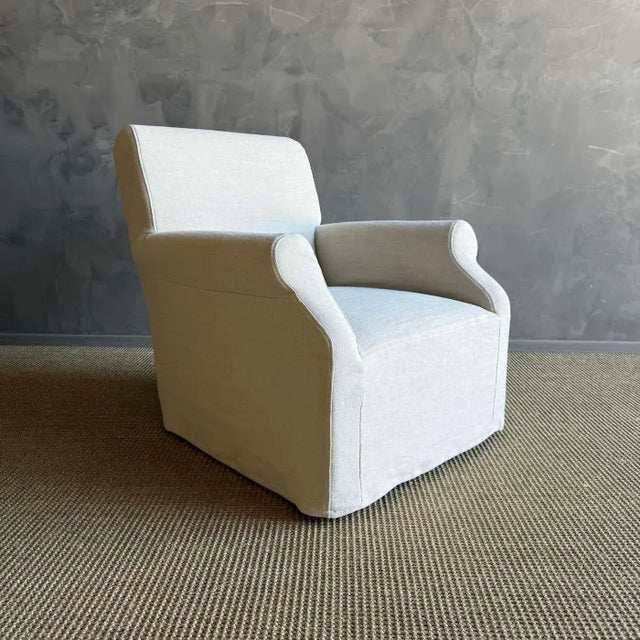 Introducing the Ans Belgian Linen Slip Covered Accent Chair, exuding classic European style with its elegant design....