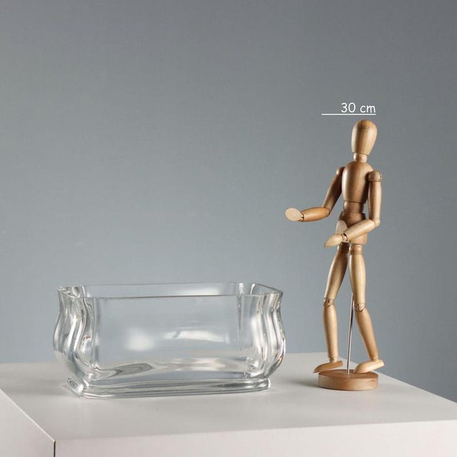 Baccarat Asmodee crystal centerpiece. Transparent and rectangular in shape, it features thick, curved sides. The base...