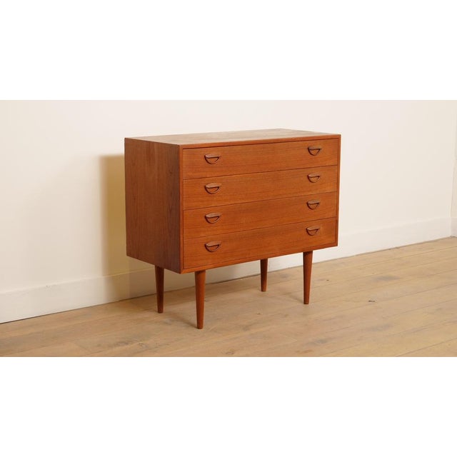 Fantastic Danish vintage chest of drawers designed for Feldballes Mobelfabrik. The four drawers have beautiful handles....