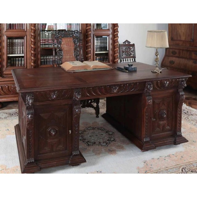 Neo-Renaissance writing desk made of solid oak. The table is double-sided (it is not only open to the space, but has...