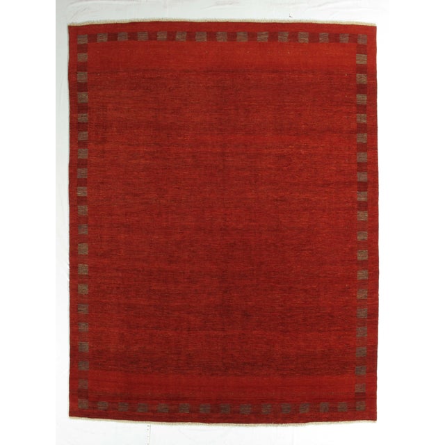 Vintage hand-knotted Persian Fine Lori Gabbeh rug featuring a soft, open field with a delicate linear border and subtle...