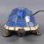 A charming vintage table lamp featuring a beautiful turtle, a classic 1970s decor accessory capable of creating a warm and...