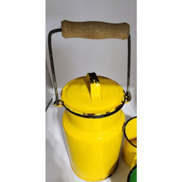 A rarity to find a vibrant yellow milk jug with 3 original cups! From 1950s Poland, there is some normal wear to the...