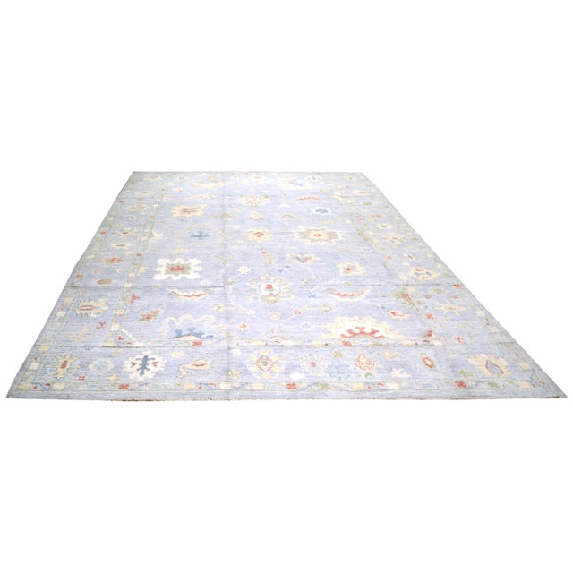 Hand-knotted with care using traditional rug making techniques, this wool rug blends timeless craftsmanship with a modern...