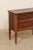 An Italian wooden chest of two drawers from the 19th century. This antique wooden chest from Italy has a rectangular-...