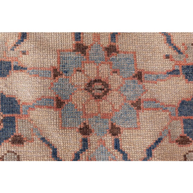 This circa-1920 antique Persian Malayer rug features an intricate all-over design including the herati pattern, a common...