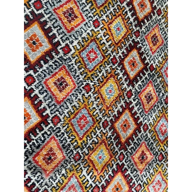 Very beautiful Moroccan rug with a nice geometric design and beautiful colors with orange, red, blue and purple, entirely...