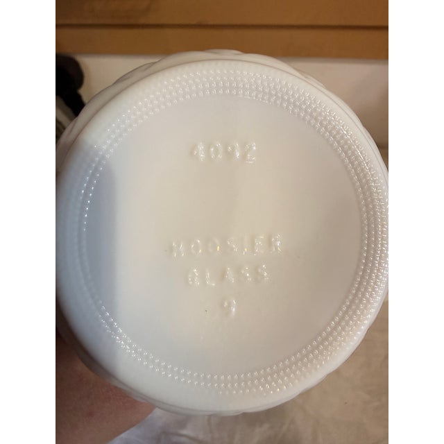 11 miscellaneous milk glass vases. Some vases had information on the base (see photos). Sizes vary. I did put a size in...