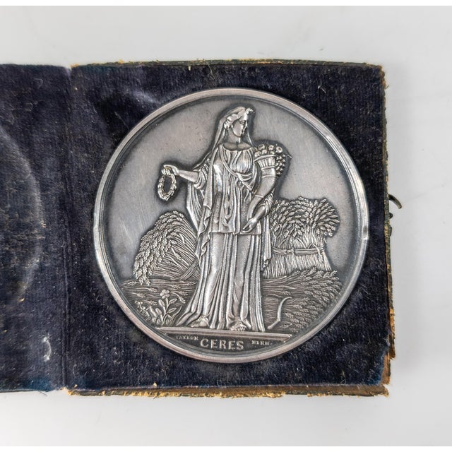 We are selling this great little American coin silver Medal. This medal has original case. The front features Ceres the...