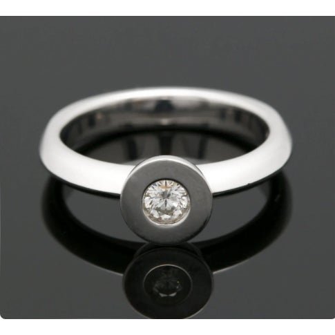 Simple and Beautiful 18K White Gold Diamond Solitaire Ring 18K white gold diamond solitaire ring featuring a bezel set...
