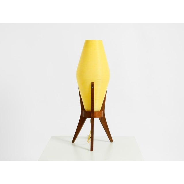 Beautiful large mid-century modern table lamp with a tripod base made of walnut wood. Lampshade made of pressed, grooved...