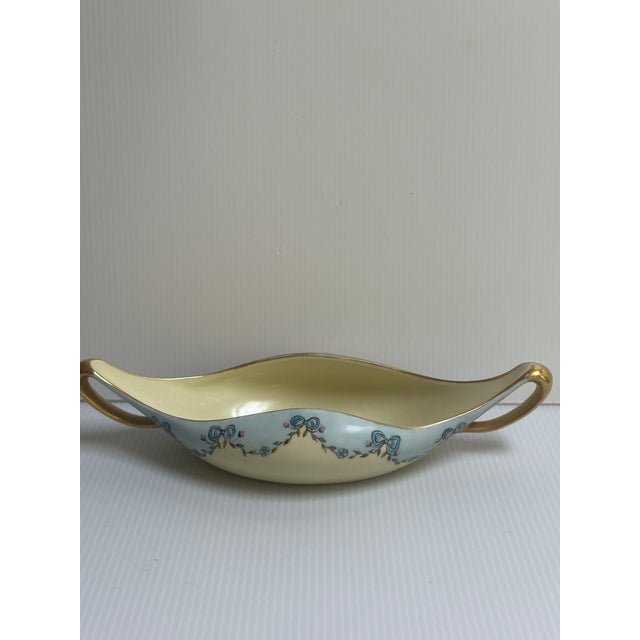 Antique T & V Tressemann and Vogt Limoges France bowl with a unique canoe-shaped two gold trim handles, hand painted with...