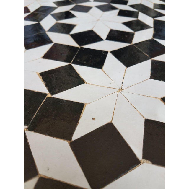 100 % glazed. Round shape. Black and white Moroccan mosaic table measuring approximately 24" in diameter. For both indoors...