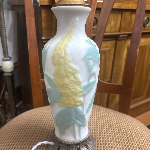 The Phoenix Consolidated Foxglove table lamp in the image was likely made in the 1920s. Production Period: The specific...