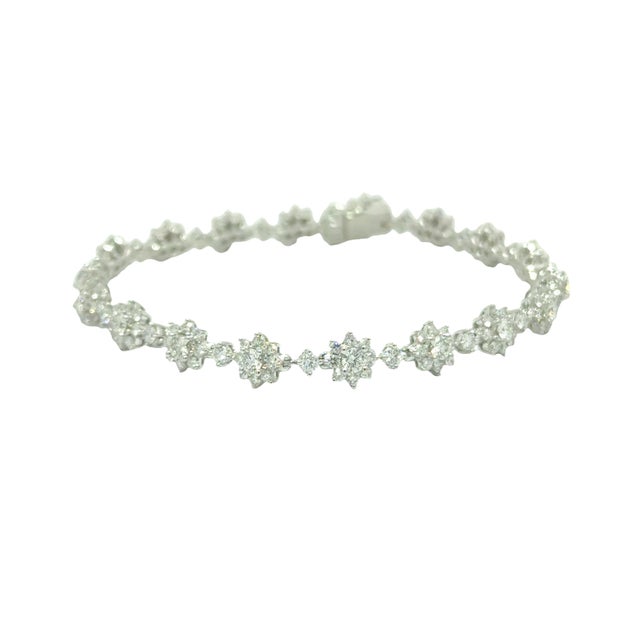 A sleek tennis bracelet featuring 4.27 carats of round, white diamonds. The diamonds are set in 18k white gold, creating a...