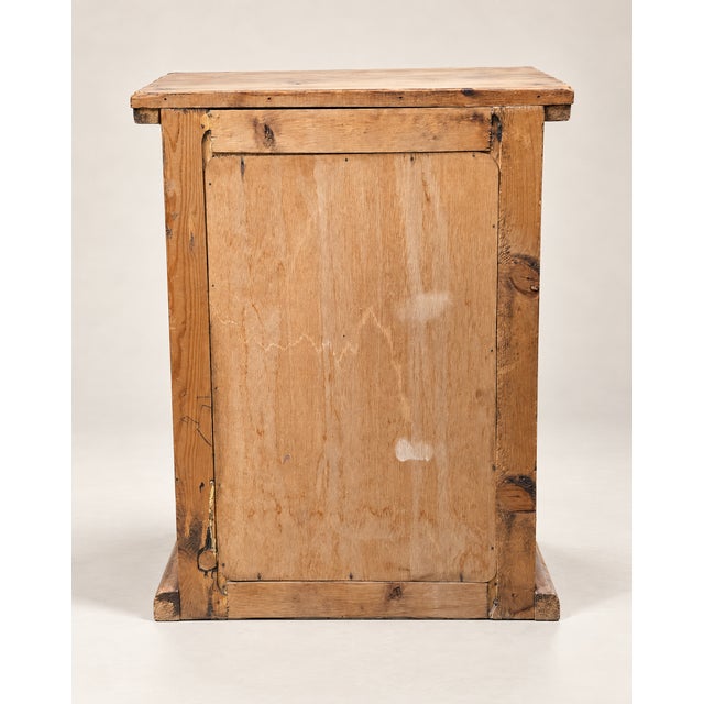 A rustic three-drawer pine chest with a wonderfully simple country form and naturally aged surface. Constructed with a...