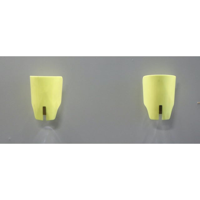 Pair of wall lamps, Model No. 167 px, 1952. Opal methacrylate diffuser with lacquered metal support. Made in Italy by...
