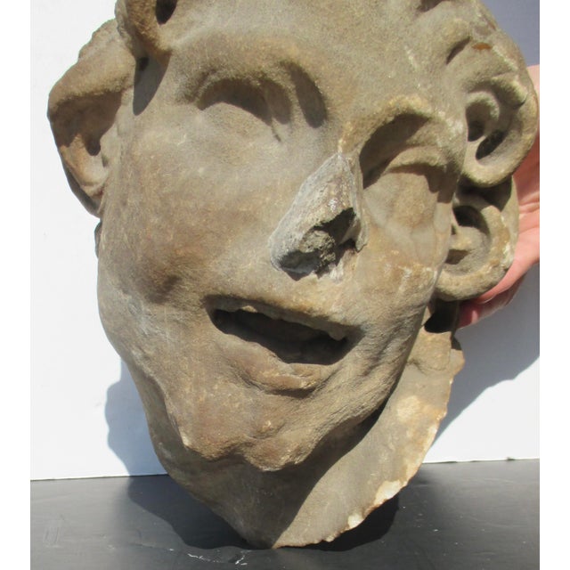 Limestone head fragment of a satyr head. Sourced from Brooklyn theater salvage. Life-sized head with a terrific expression...