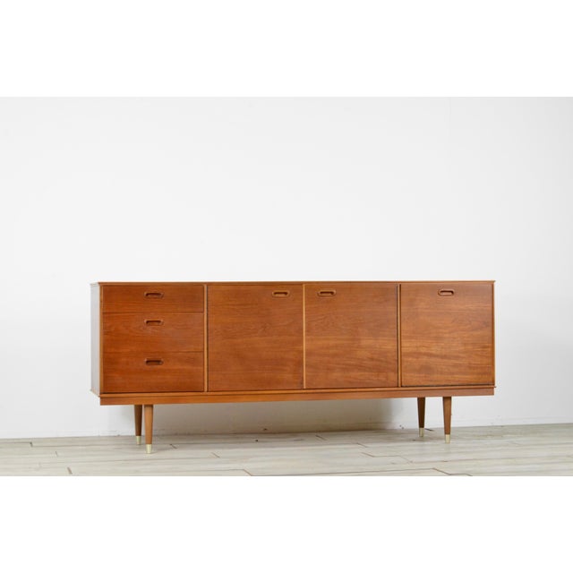 Mid-Century Modern Teak Sideboard from Avalon, 1960s, in Very Good conditions. Designed 1960 to 1969 This piece has an...