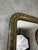 A late 19th-century rectangular mirror in wood and gilt stucco, with rounded upper corners. Its frame features a richly...