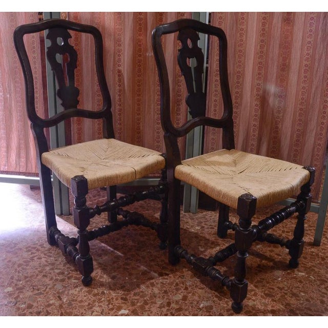 Pair of wooden spool high chairs with straw seats, made in italy in the late 19th century. The shaped backrest and the...